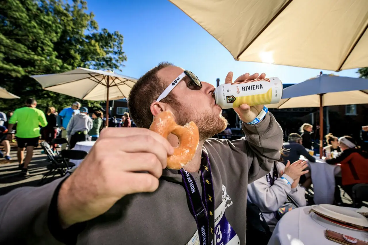 Man eating and drinking at an event