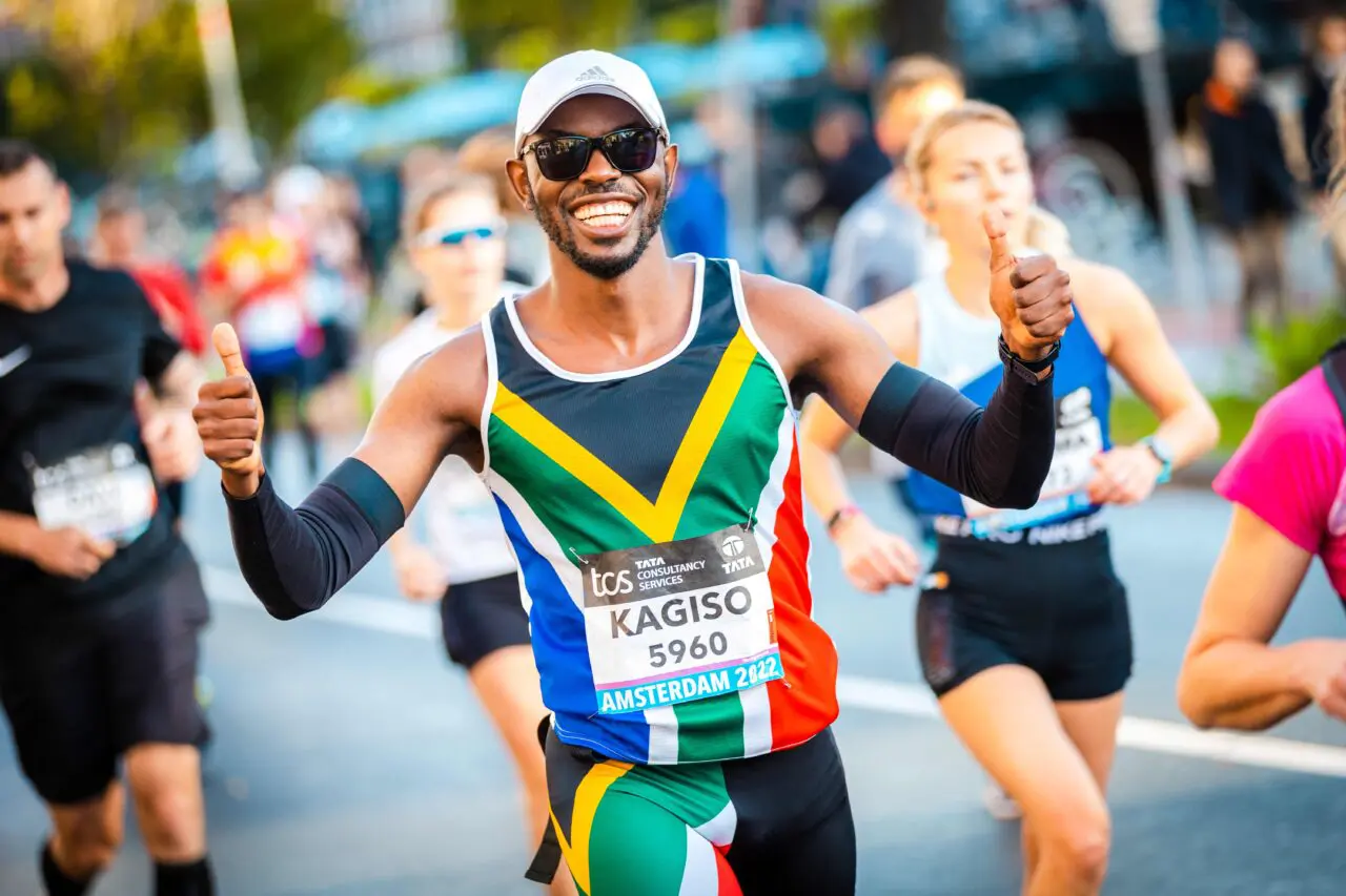 A South African runner poses to the camera during the Amsterdam Marathon