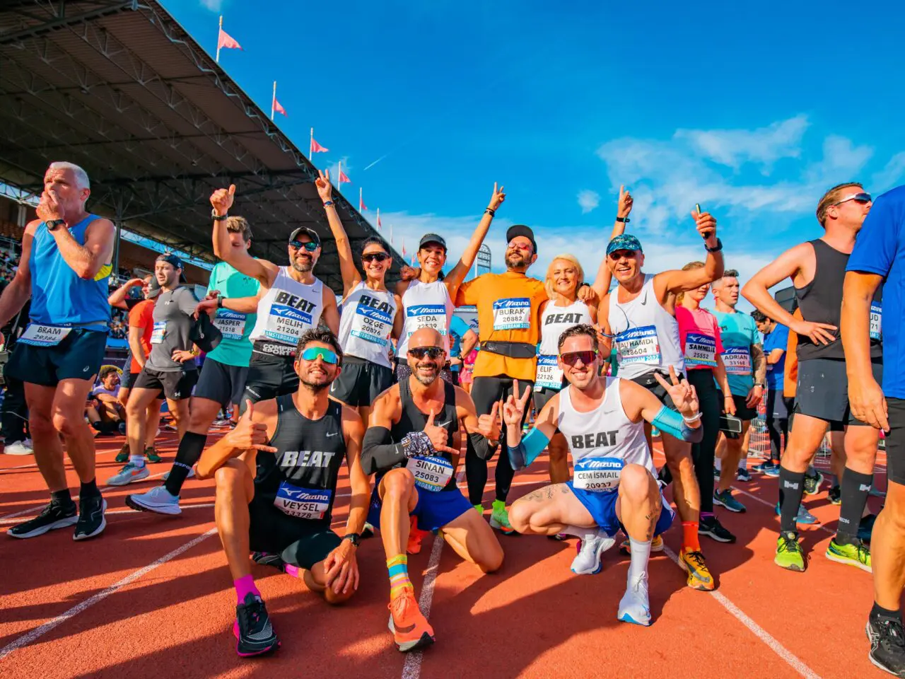 Runners celebrate at the end of the Amsterdam Marathon